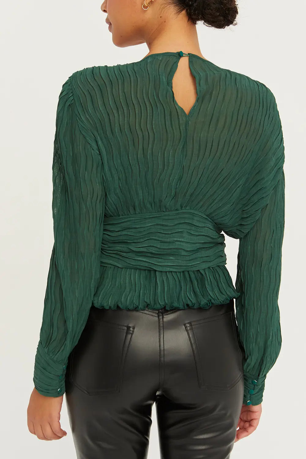 Green V-neckline, Poet long sleeves, Sleeve button cuff, Lined in the chest area and waist, Back keyhole, Ruffle detail at bottom hem